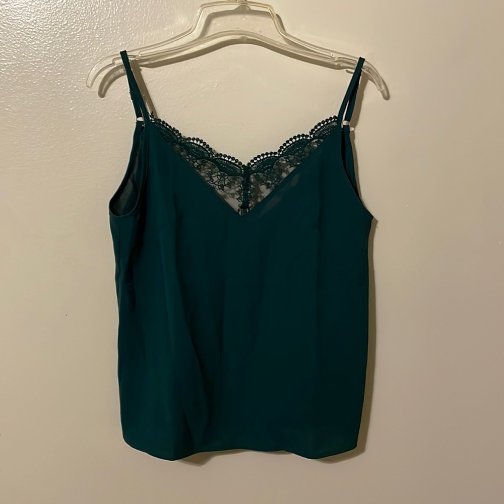 Brand new tank top with a low back.